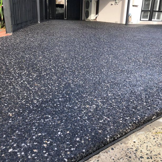 House entrance with exposed aggregate concrete